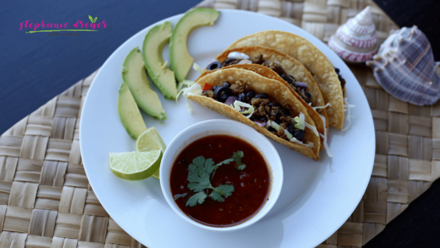 These vegan beef and black bean tacos are meaty without the meat! Beyond Meat Beef Crumbles stand in for a delicious meatless taco.