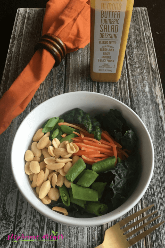 This Carrot Noodle Bowl with Almond Butter Turmeric Dressing is crunchy and satisfying - and all you need is 10 minutes and 5 ingredients! #veganbowl