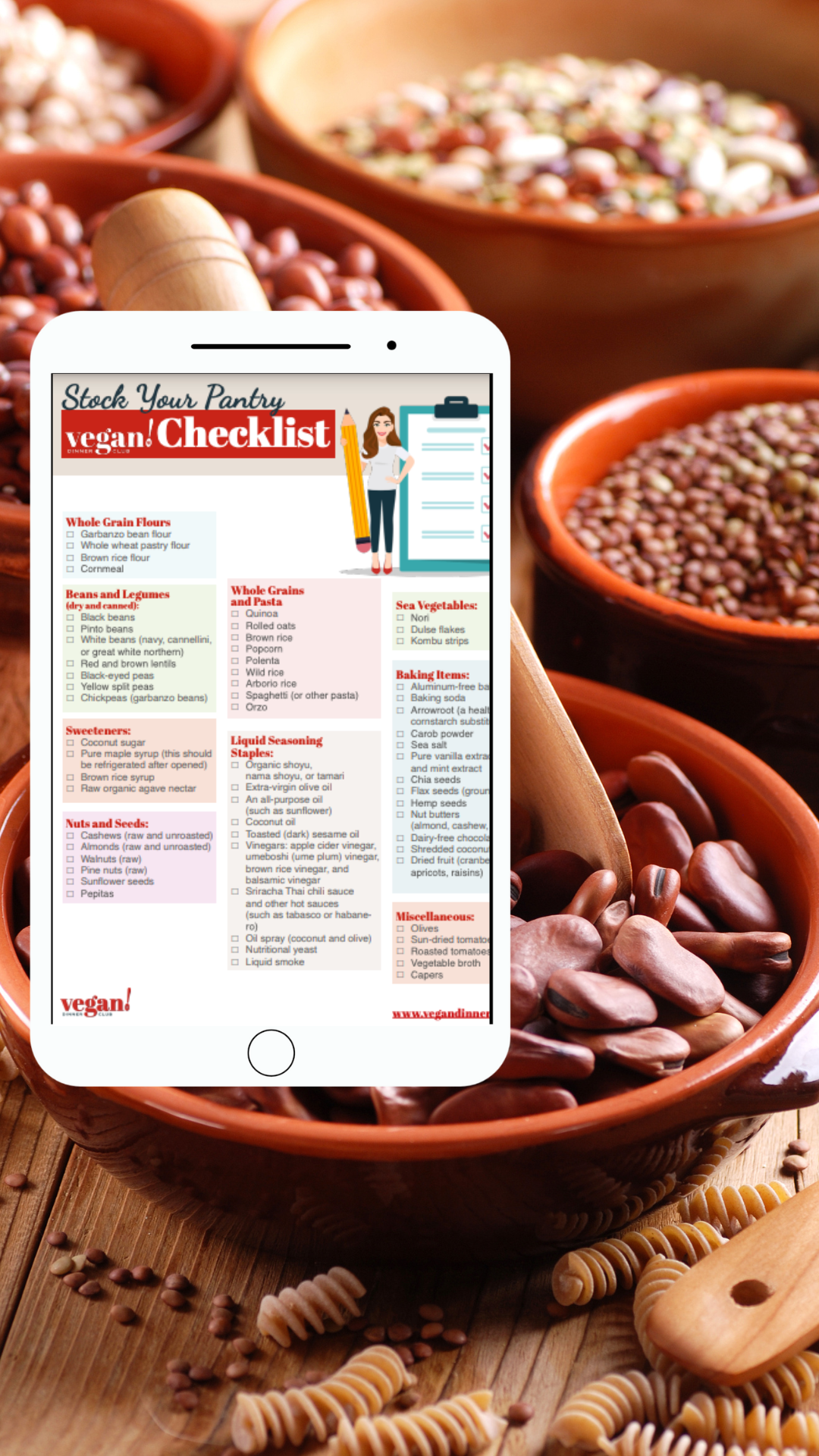 Ipad with pantry checklist on it on top of bowls of beans