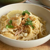 Bowl of pasta on a wood cutting board