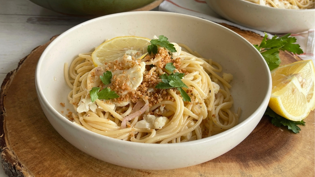 Bowl of pasta on a wood cutting board