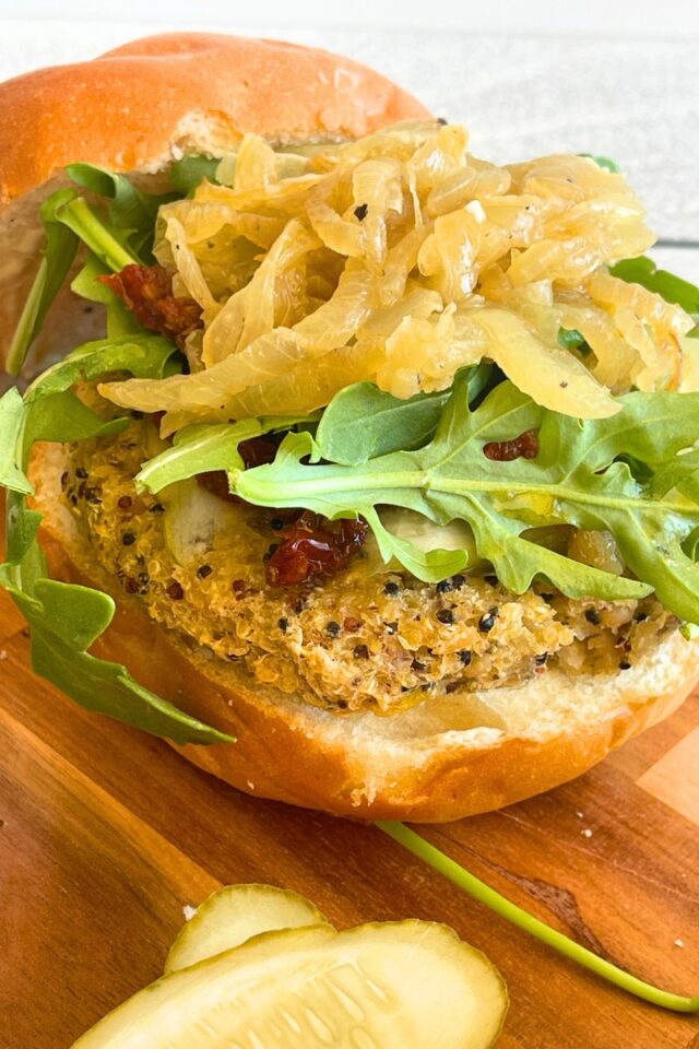 open-faced burger on a cutting board