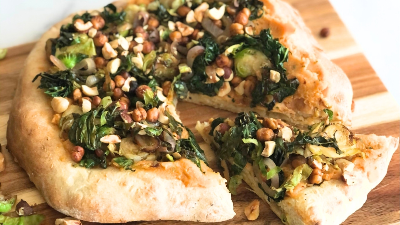 pizza on a wood cutting board