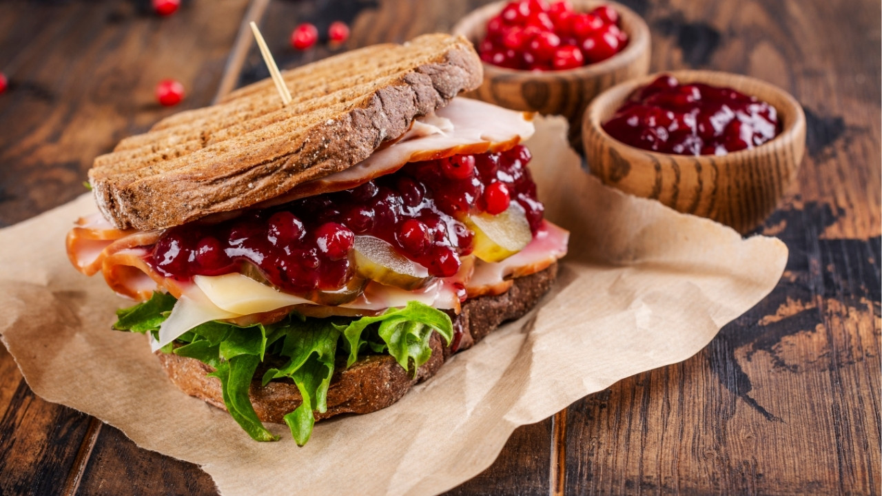 thanksgiving sandwich on a wood cutting board