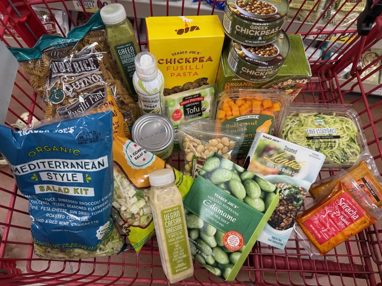 red shopping cart full of Trader Joe's meals