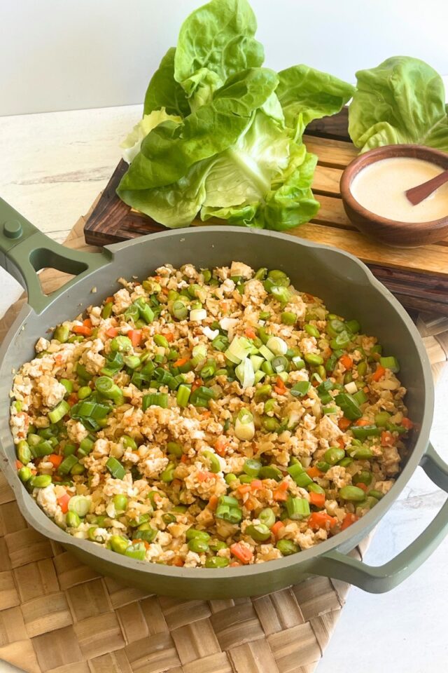 green skillet full of cauliflower rice